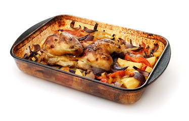 Baked chicken with vegetables in glass baking tray