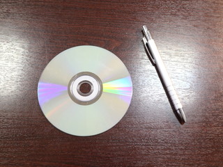 pen and CD on the office table
