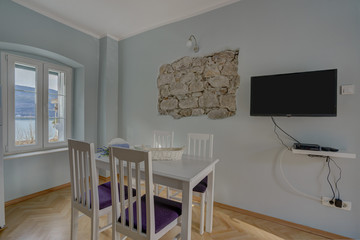 Interior of a living room with view from the window to the sea in a private house