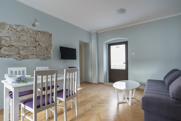 Interior of a living room with view from the window to the sea in a private house