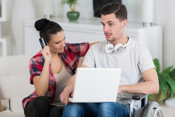 portrait of a modern couple with smart phone and laptop