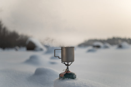 Boiling Tea In A Titanium Mug On A Gas Burner