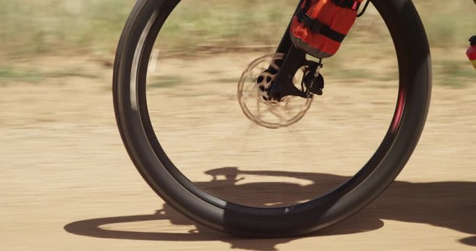 Close up, bicycle tire on dirt road