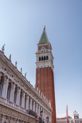 Fototapeta na wymiar St. Mark Square Campanile. Clock Tower of Venice against clear sky, Italy.