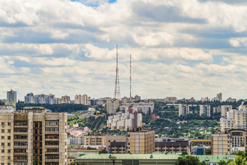 Naklejka premium Belgorod cityscape skyline, Russia. Aerial view. Residential apartment blocks of city. TV towers on horizon. Inscription on roof of building at bottom left: 