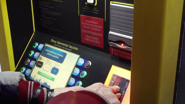 Man's hands replenishes the Istanbul card in an ATM for travel by public transport Istanbul, Turkey. HD video clip