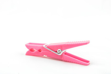 Pink clothespin on white background