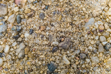 Natural coarse sand. Surface grains of sand close-up.