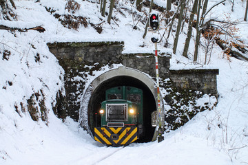 Naklejka premium Passenger train, mountain rail. Hungarian forest railway at winter.
