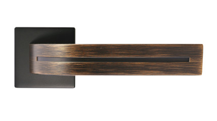 Door handle of copper color on a white background