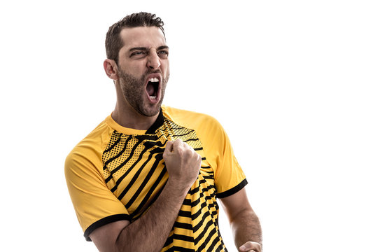 Soccer fan with yellow shirt celebrating on white background