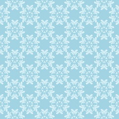 White floral ornament on blue. Seamless pattern