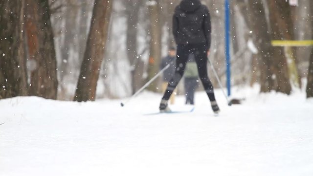 Girl cross country skiing in the winter park