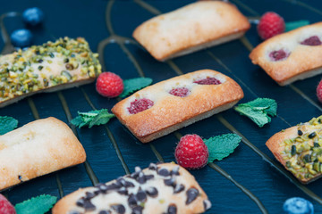 Vegan cakes decorated with mint and berries.