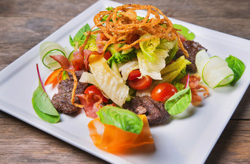 salad with meat, dried squid and vegetables