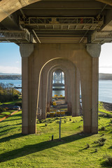A view along the underside of the old Forth Road Bridge, looking south from North Queensferry, Fife.