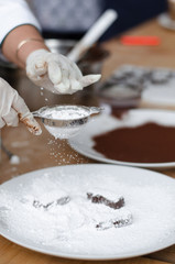 cooking homemade chocolates in chocolate glaze in the workshop. Master Class