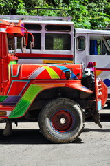 Filipino orange-red dyipni-jeepney parked at the bus station. Sagada-Mountain province-Philippines. 0237 © rweisswald
