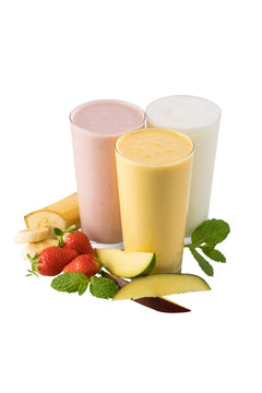 Set of three Indian traditional yogurt milk shakes lassi or smoothie isolated on white background - plain, banana and strawberry flavored