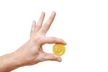 hand holding a golden virtual bitcoin isolated on white