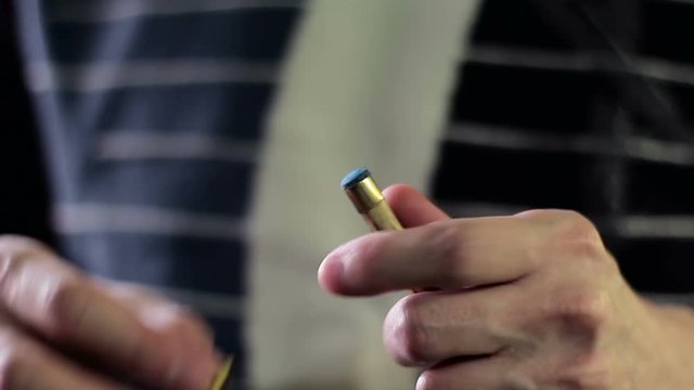The billiard-player chops the snooker cue with chalk