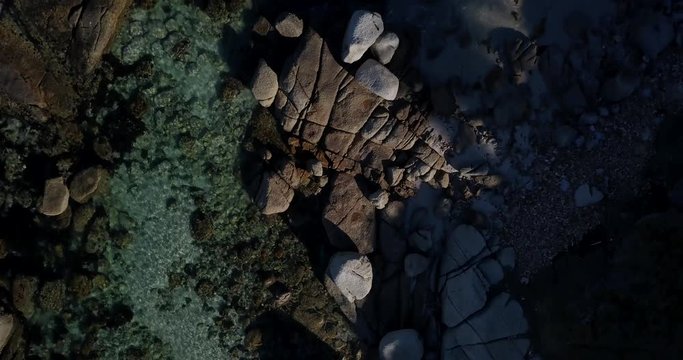4K high quality aerial summer afternoon footage of Western Cape's coast, Simon's Town beach boulders, water, sandy sea front, Atlantic Ocean views in the background near Cape Town, South Africa