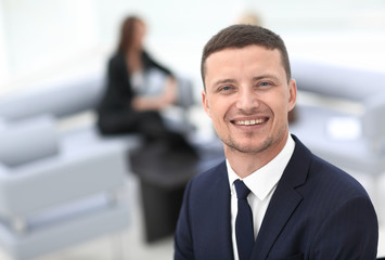 successful businessman on blurred background office