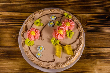 Kiev cake with cream on wooden table. Top view