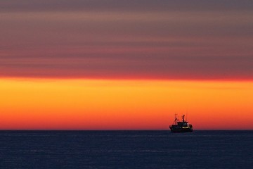 Fishing-boat during sunset