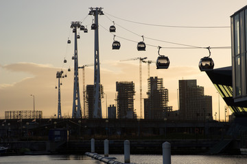 mountain lift near city at sunset