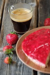 Fresh strawberry pie and coffee on the table  