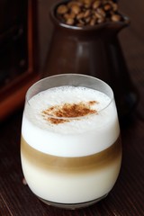 Delicious coffee latte with cinnamon in a glass 