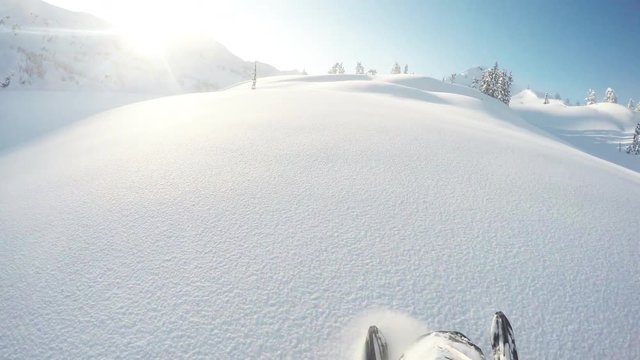 Snowmobiling in Eagle Pass mountain landscape, POV