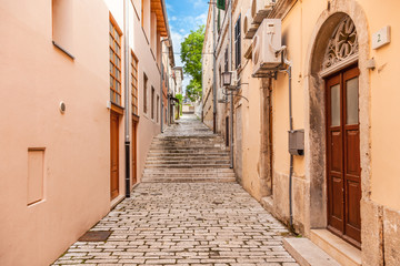 Fototapeta na wymiar Old town street. View of the street in old town of the Pula city, Croatia.