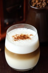 Delicious coffee latte with cinnamon in a glass 