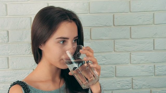 Beautiful girl with a glass of water.