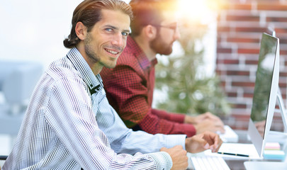 business partners are working on the computer