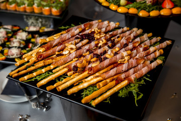 Bread sticks grissini with prosciutto