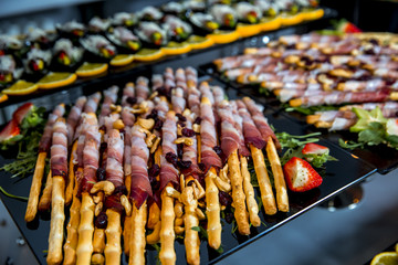 Bread sticks grissini with prosciutto