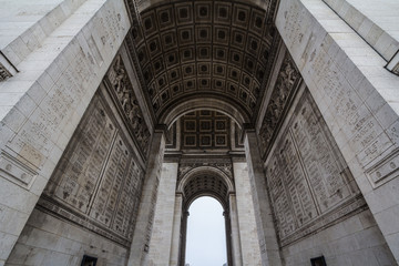  Arc de Triomphe (Triumph Arch) on place de l'Etoile in Paris, taken from below. It is one of the most famous monuments in Paris, standing on Champs Elysees on  center of Place Charles de Gaulle..