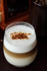 Delicious coffee latte with cinnamon in a glass 