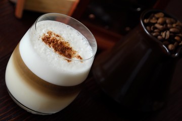 Delicious coffee latte with cinnamon in a glass 