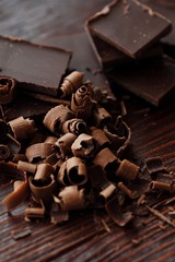 Delicious dark chocolate on a brown background 