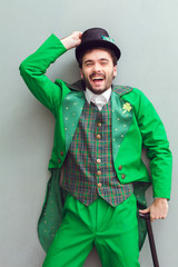 Young man top view in leprechaun costume saint patrick's day laughing
