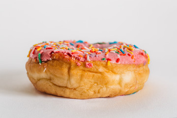 Delicious fresh donut in pink glaze