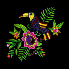 Embroidery tropical pattern with exotic flowers and toucan. Vector embroidered floral illustration with bird for clothing design.