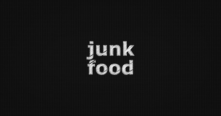 Junk food word on grey background.