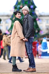 Cute young couple in warm clothes outdoors