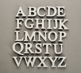 Floured alphabet letters on light background