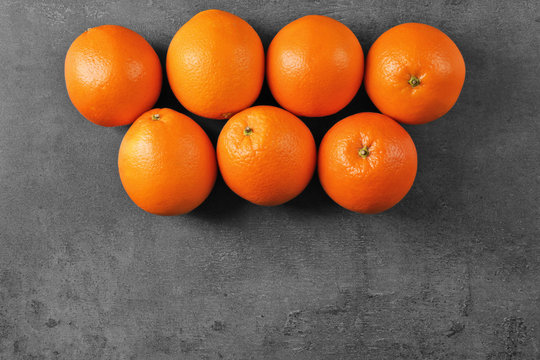Juicy ripe oranges on dark background, top view © Africa Studio